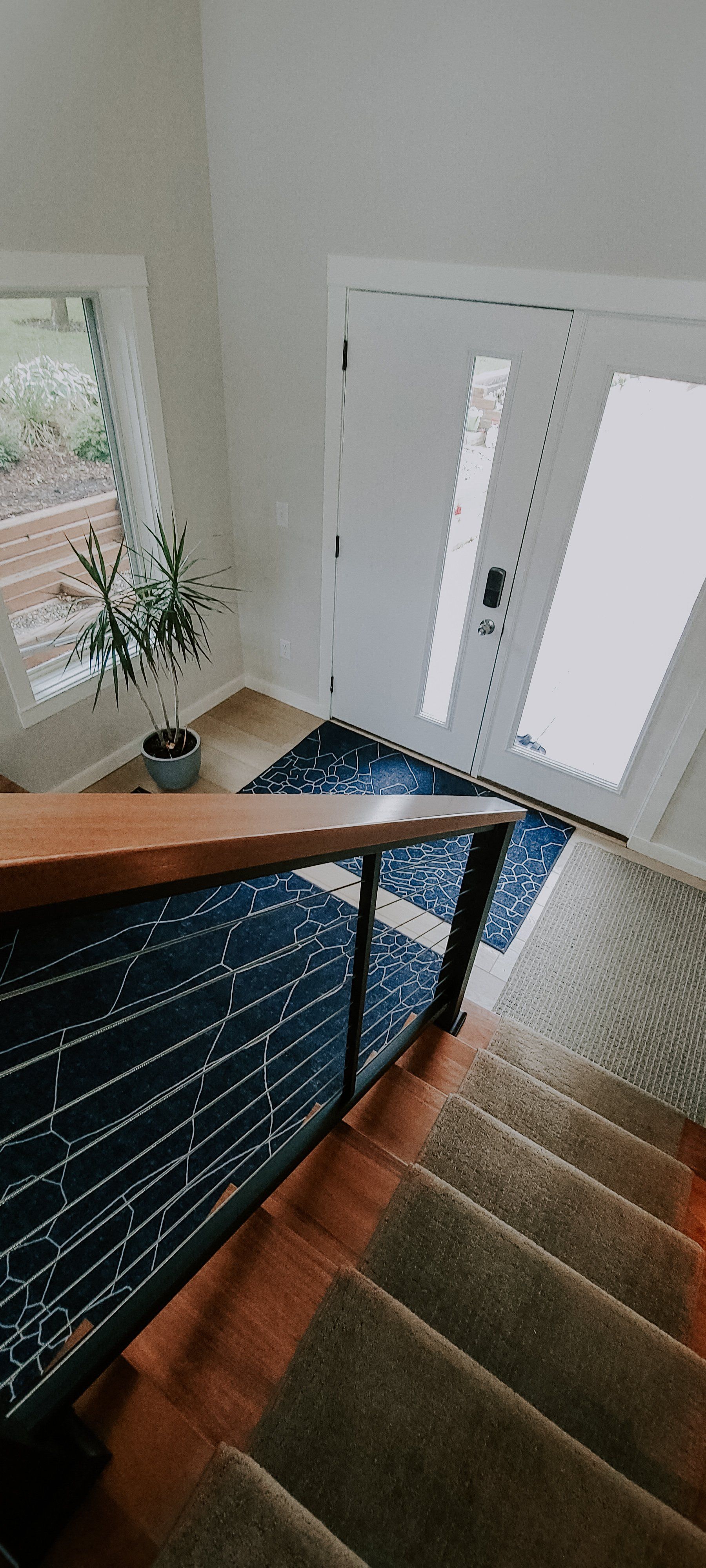wooden stairs leading to a white door