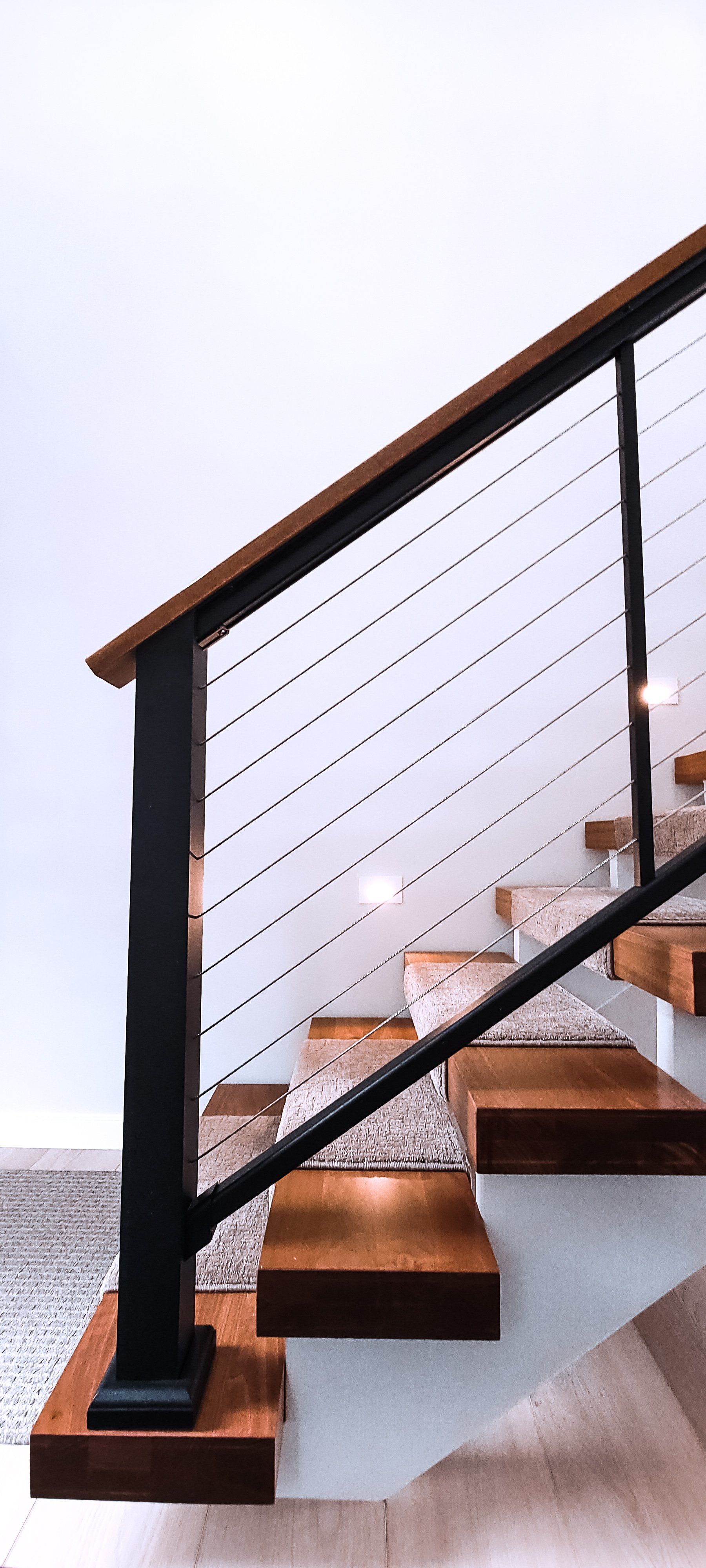 black metal stairs with wooden steps