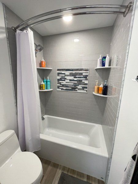 bathtub with curtain