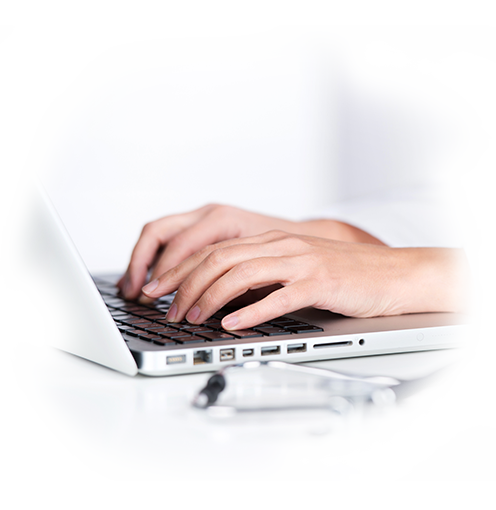 Typing on a laptop computer