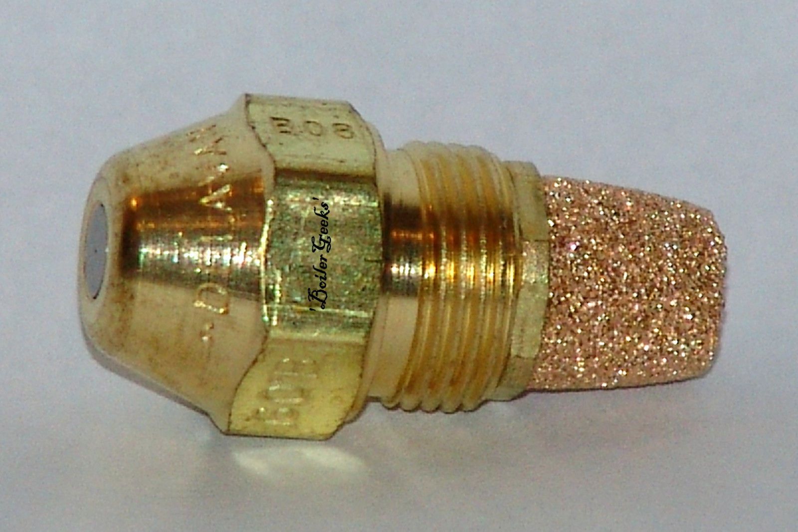 Brass oil burner nozzle with a bronze filter.