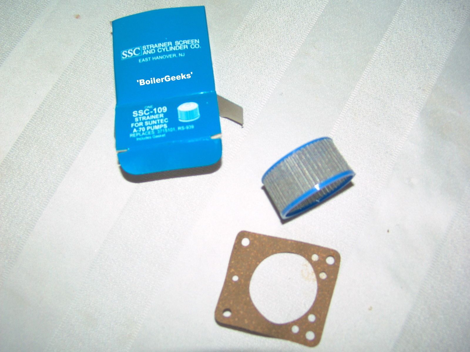 Blue Powerflow filter components: housing, filter, and gasket.