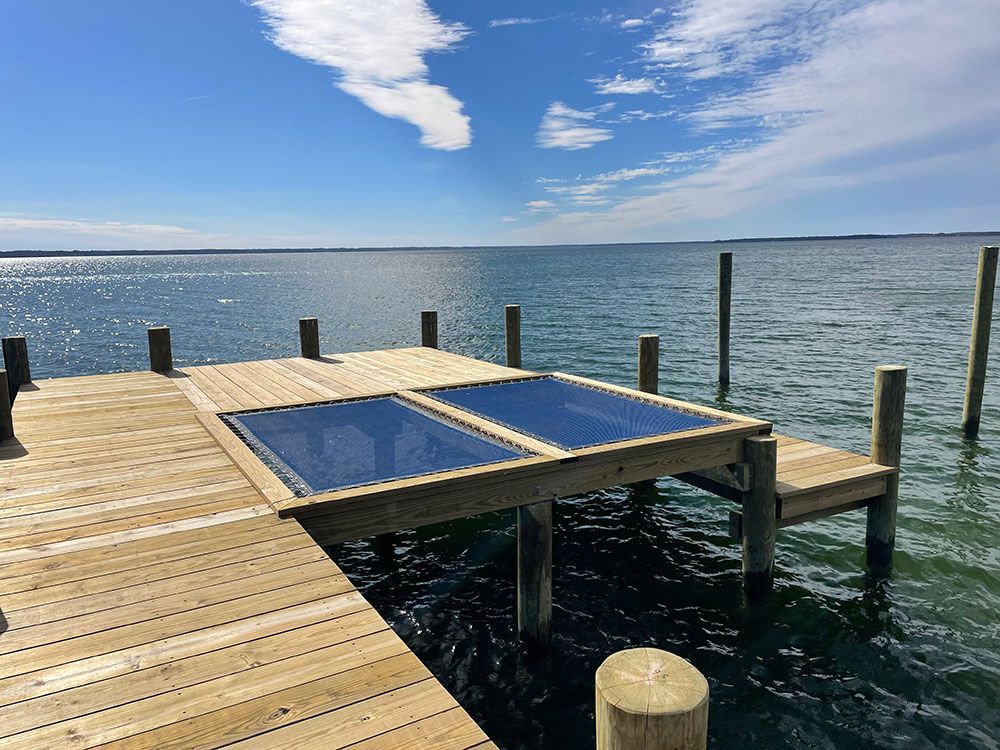 Wooden boat dock with blue cushion