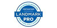 Blue circular LANDMARK PRO certification seal with white text and borders
