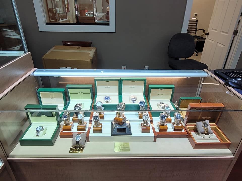 A display case with rolex watches on it