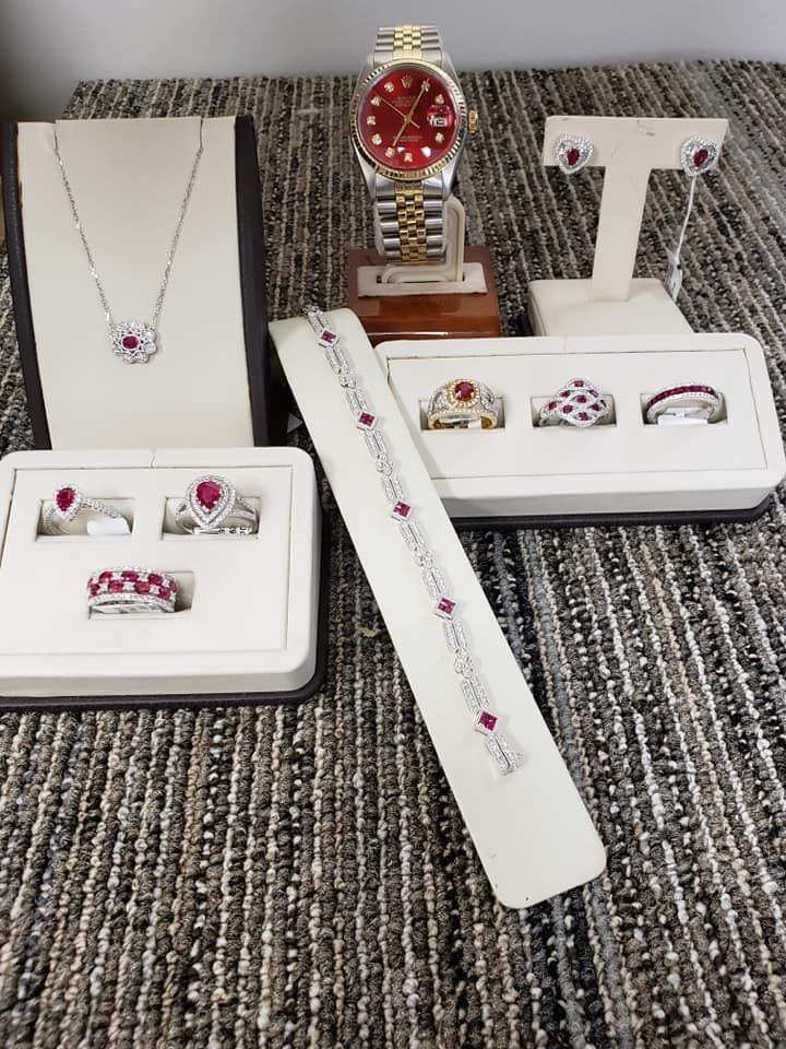 A display of jewelry including a watch and a necklace