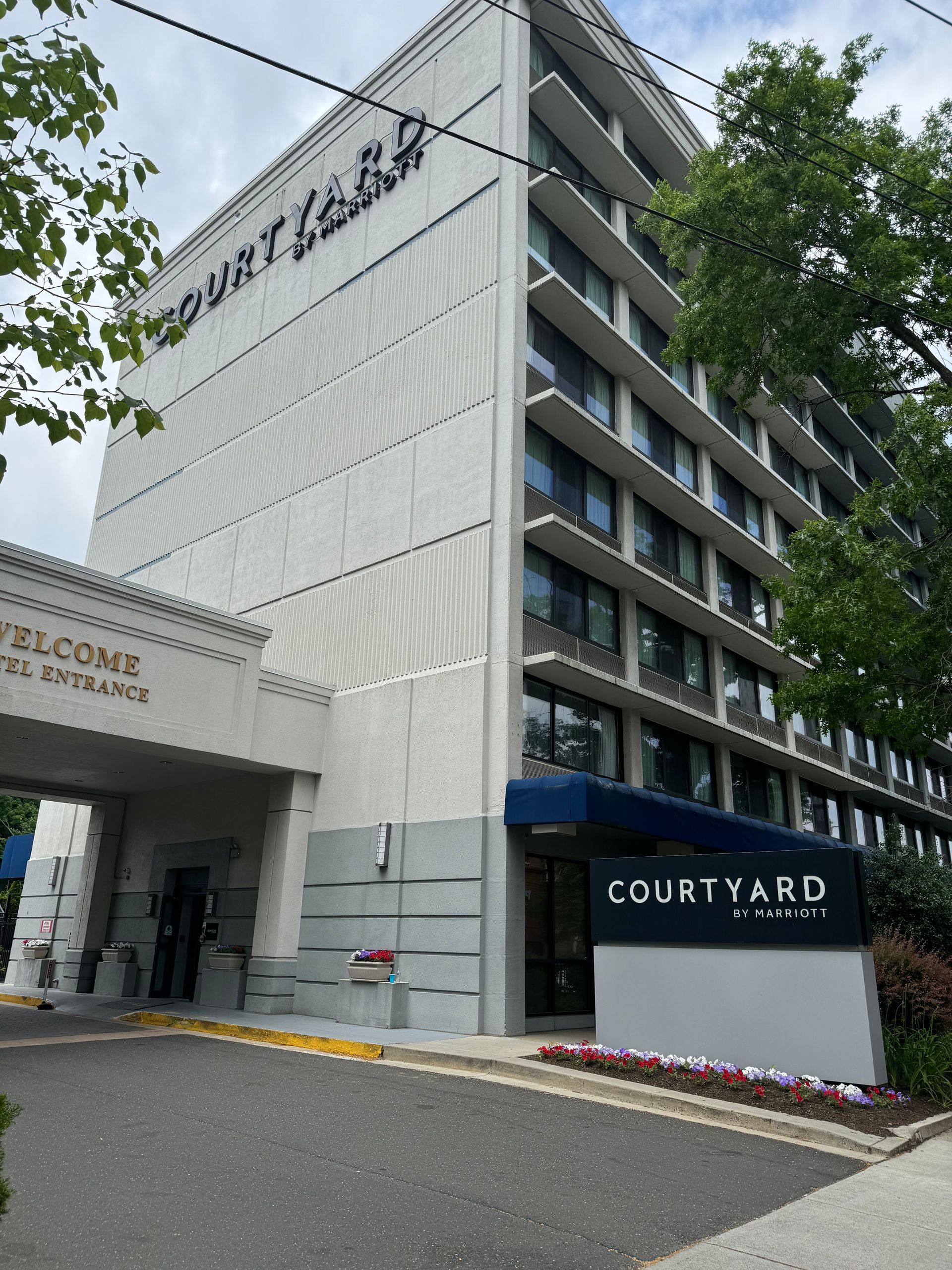 A large white building with the word courtyard on it