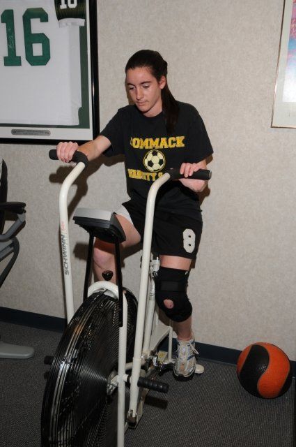 Girl using cardio bike