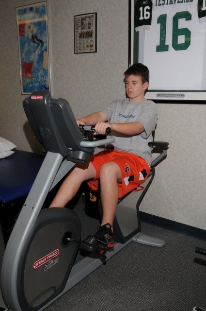 Teen using recumbent bike