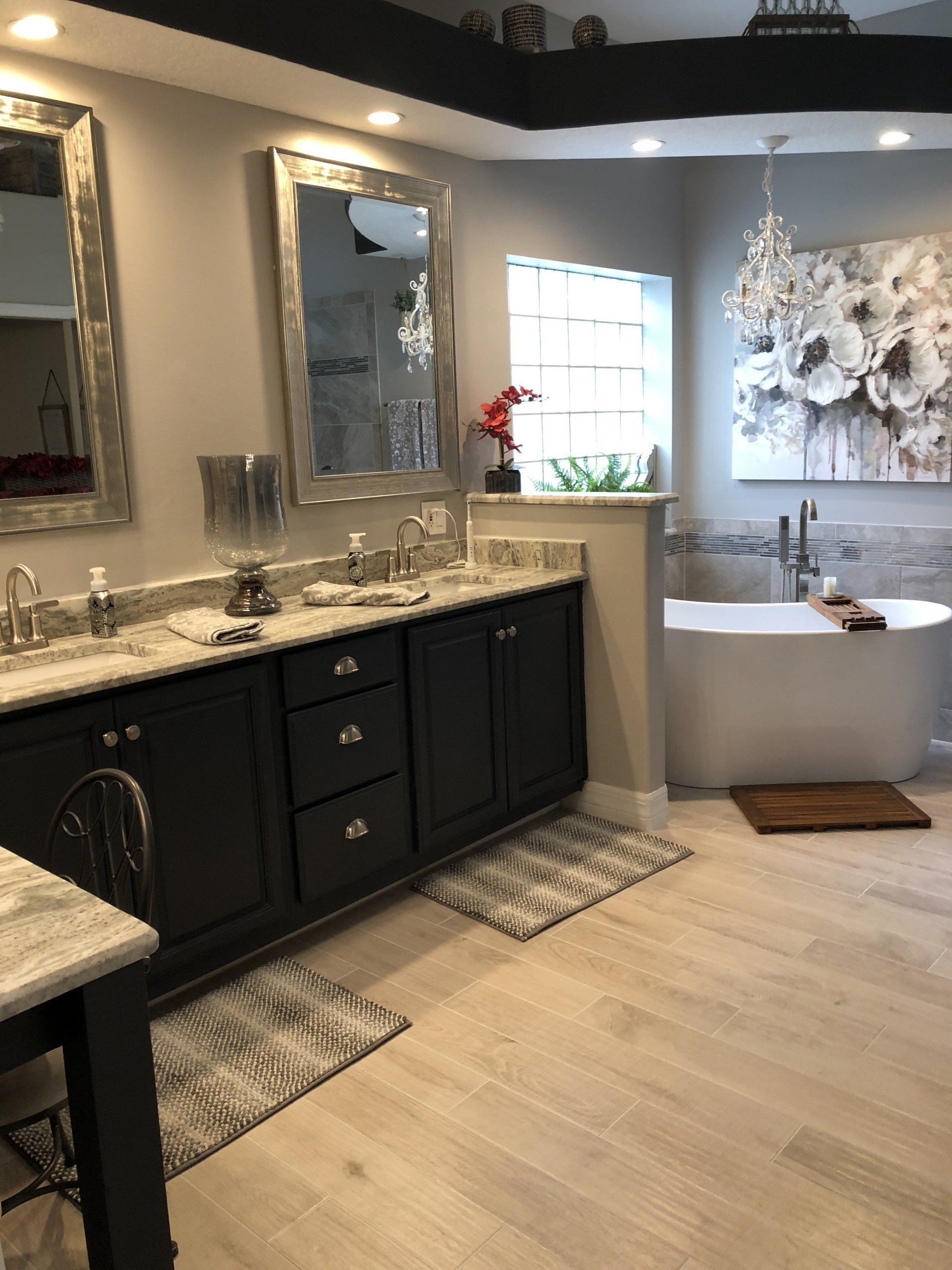 A bathroom with two sinks and a bathtub
