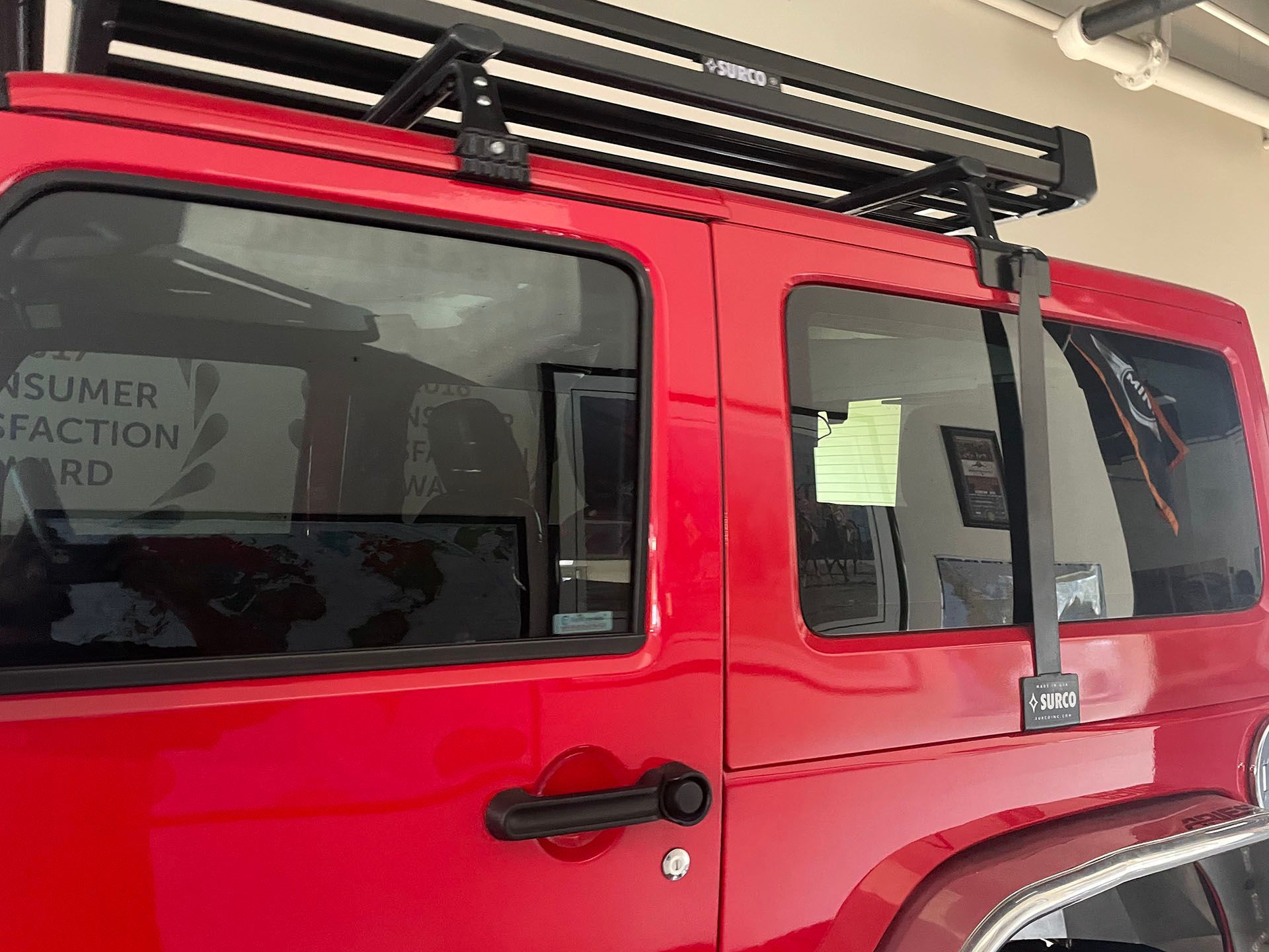 Window tinting on a red jeep