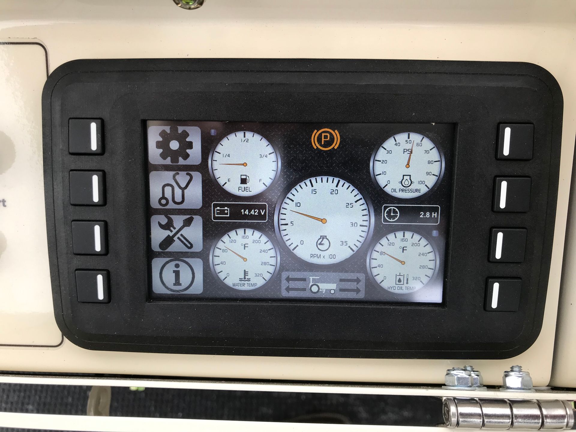 Dashboard screen with gauges and warning lights, surrounded by control buttons.