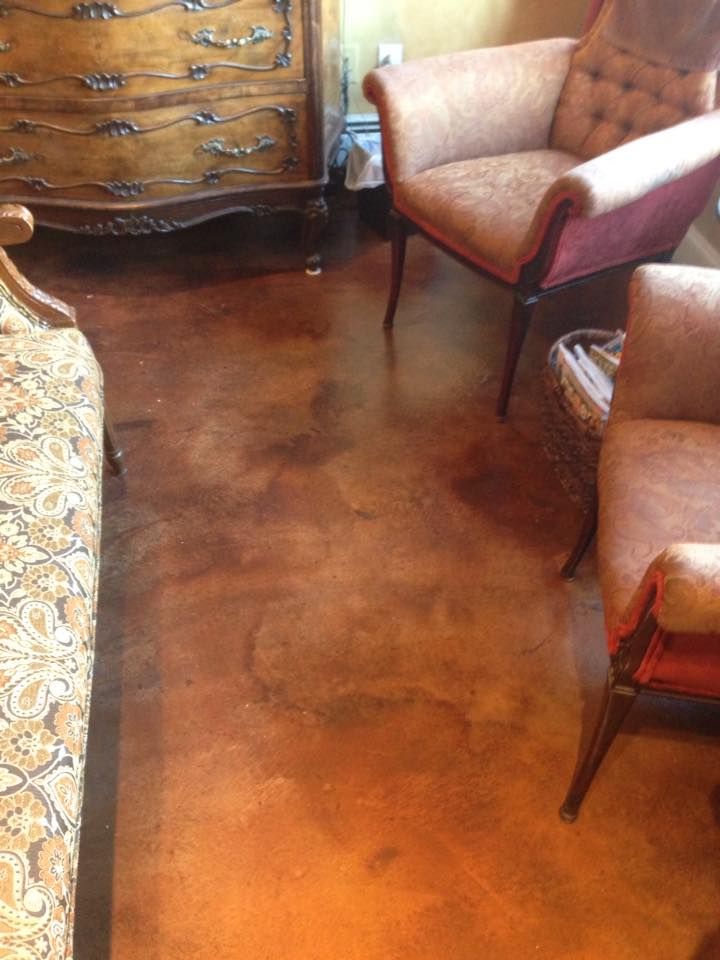 A living room with a couch , chairs , and a dresser.