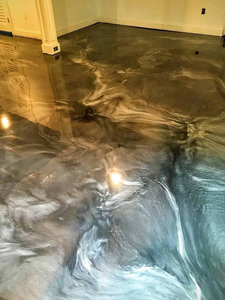 A close up of a metallic floor in a room.