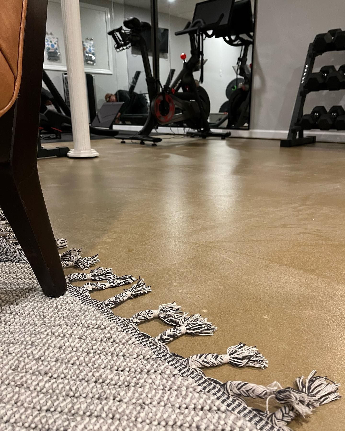 There is a rug on the floor in the middle of a gym.