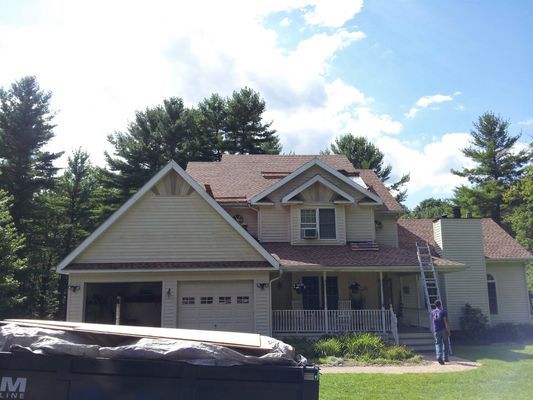 A large house with a ladder in front of it