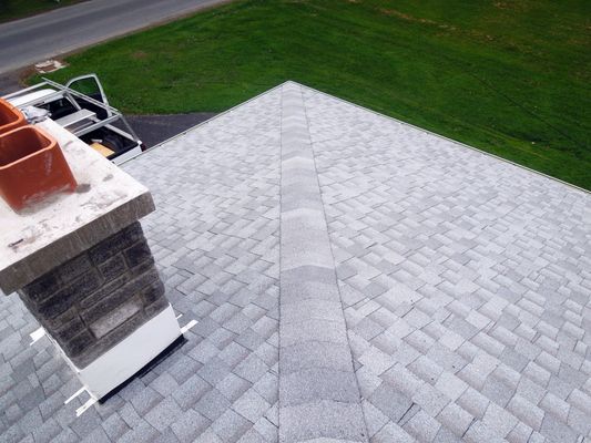 An aerial view of a roof with a chimney on it.