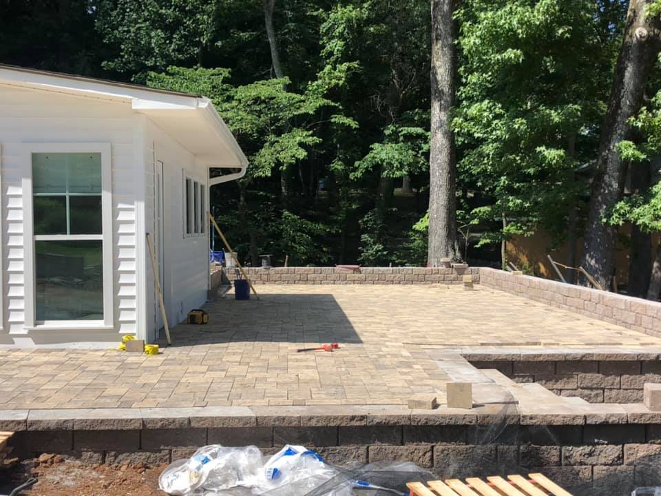 A white house with a patio in front of it