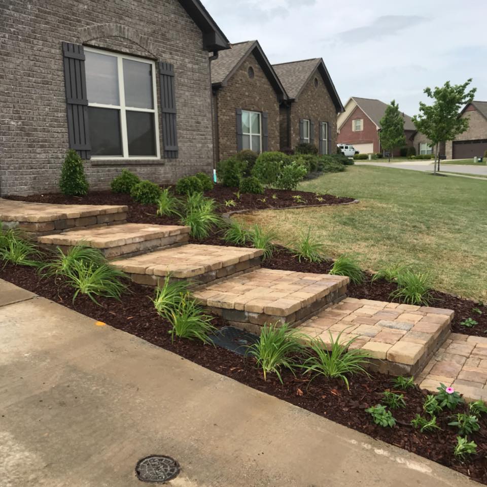 A brick house with steps leading up to it