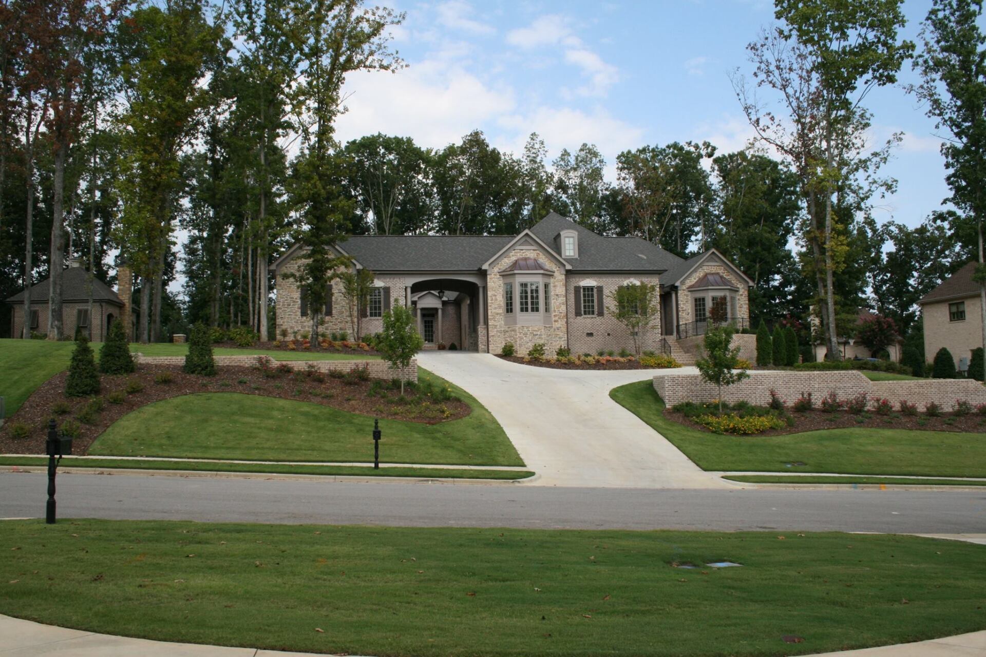 A large house with a driveway leading up to it