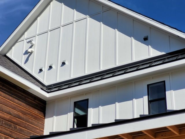 A white house with a lightning bolt on the roof