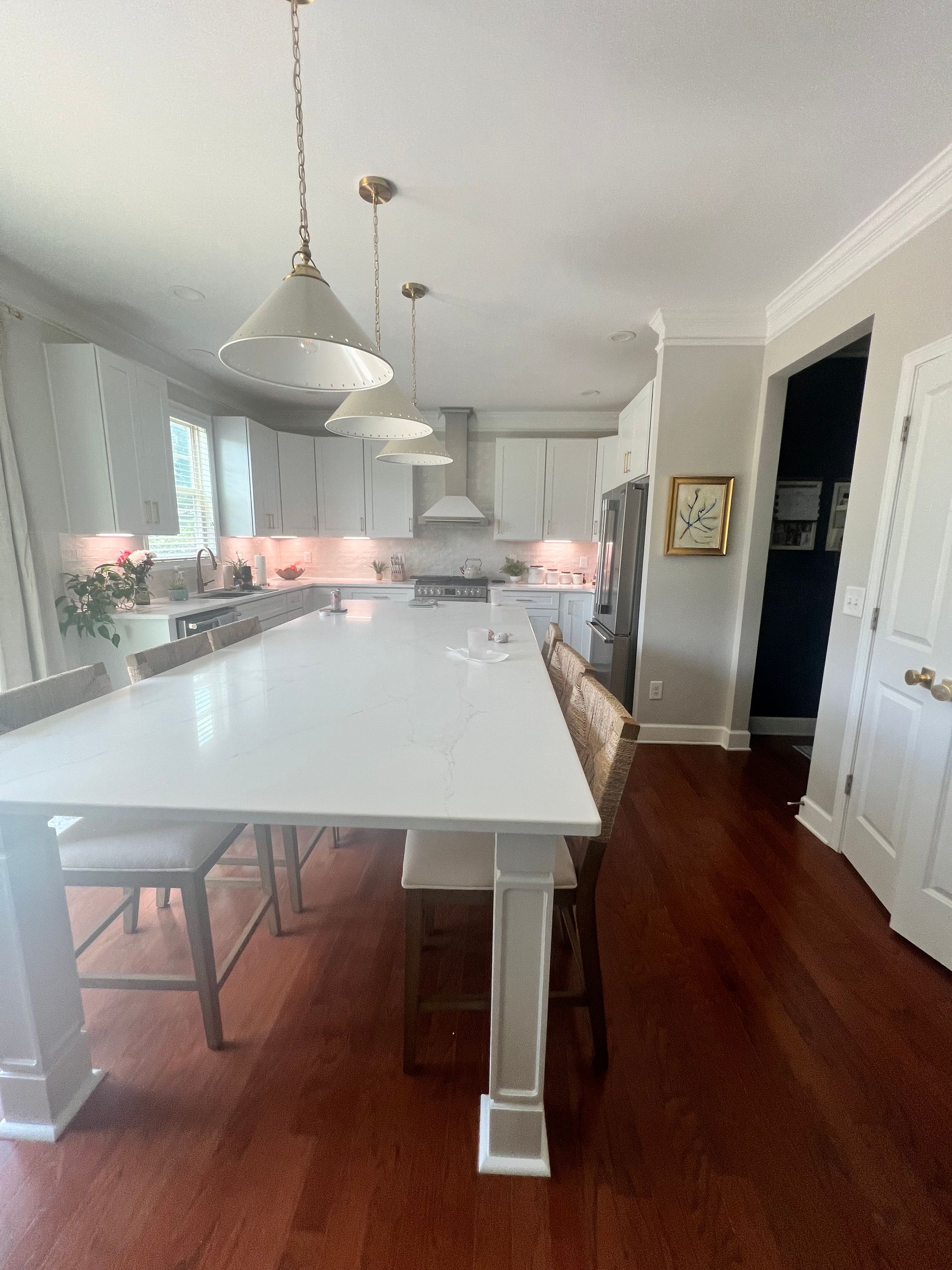 Burlington, NC home remodel with updated kitchen, quartz counters, and pendant lighting.