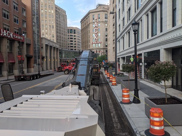 a city street with a jack in the box restaurant in the background