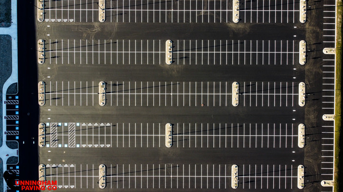 an aerial view of a parking lot with the word parking on the bottom