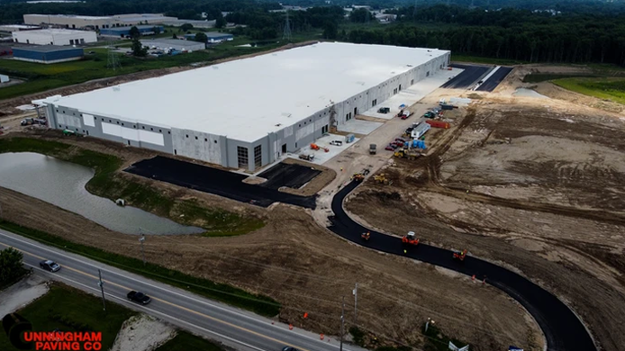 an aerial view of a large white building under construction