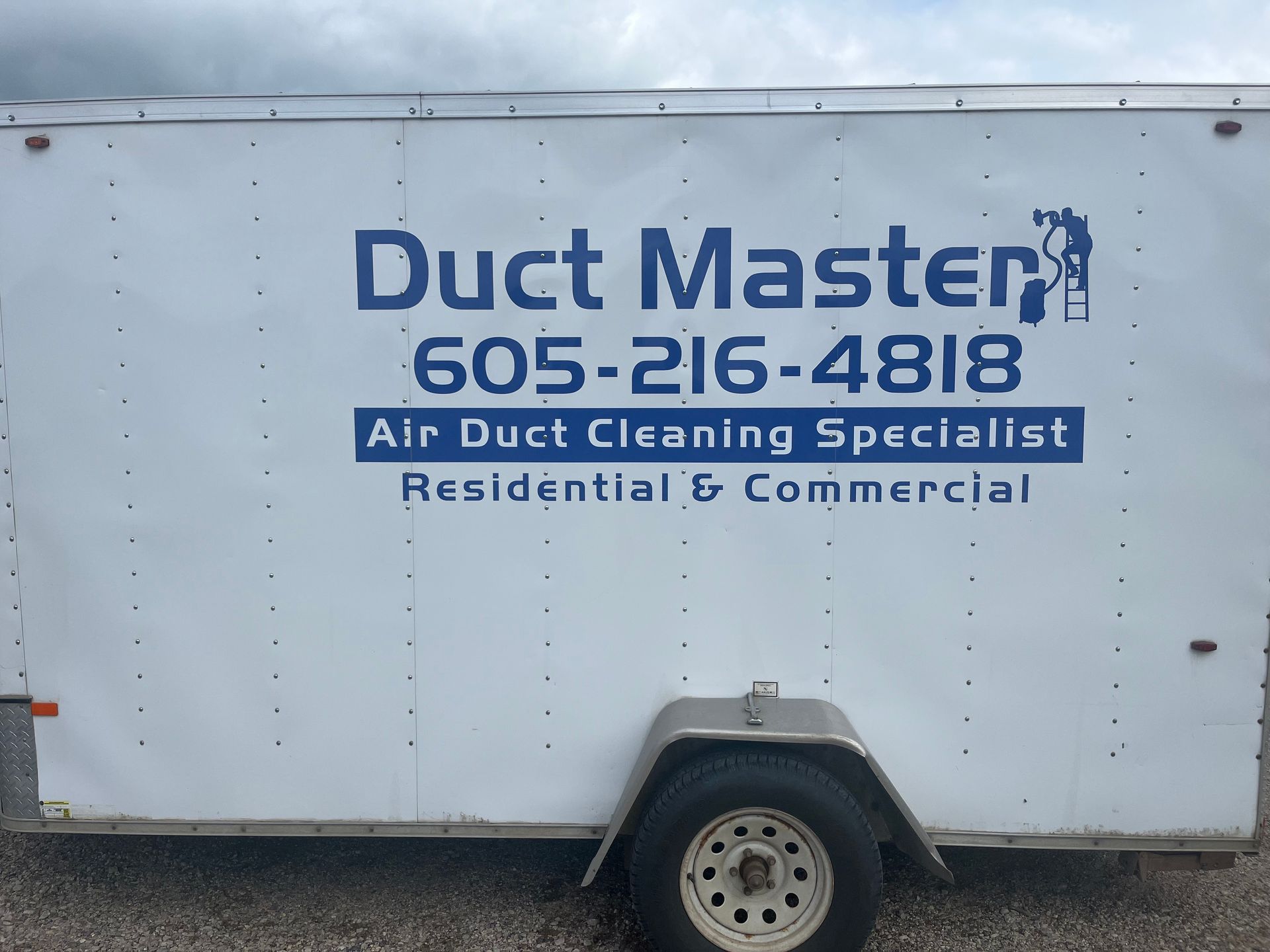 A picture of a white trailer with Duct Master written on it