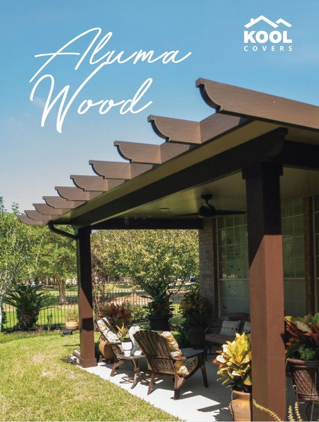 Modern resort patio with pergola, lounge chairs, and tropical landscaping under blue sky, labeled “Aluma Wood”