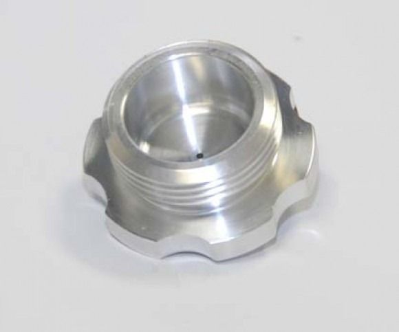 Silver metal threaded cap with a scalloped edge on a white background