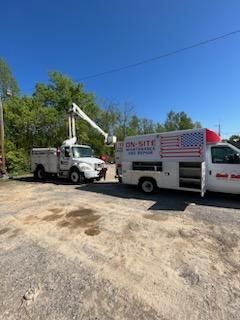 Two trucks are parked next to each other in a parking lot.
