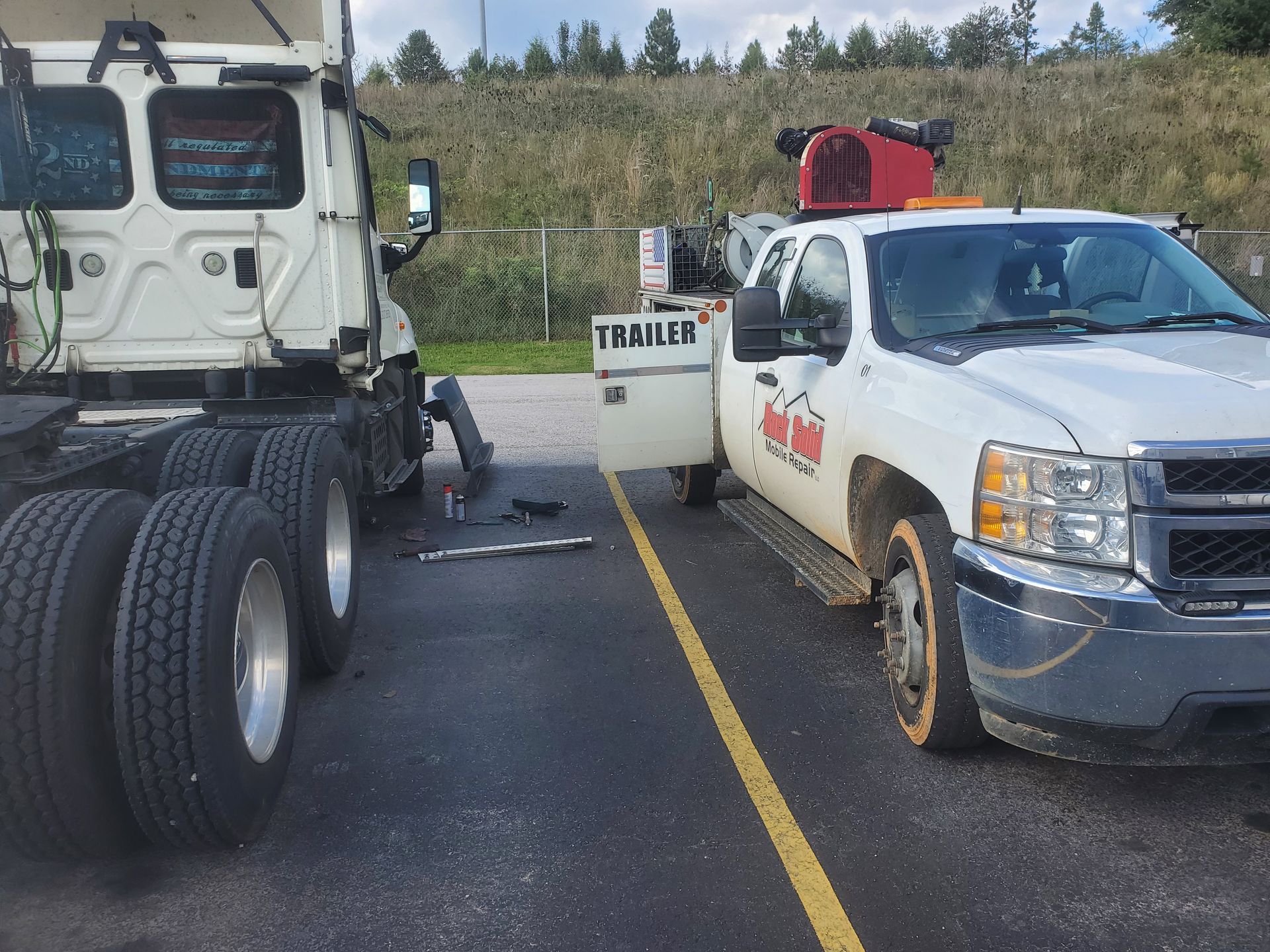 Truck trailers with tools on the ground