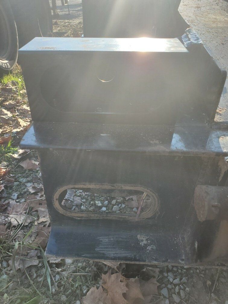 A black box is sitting on top of a wooden table.