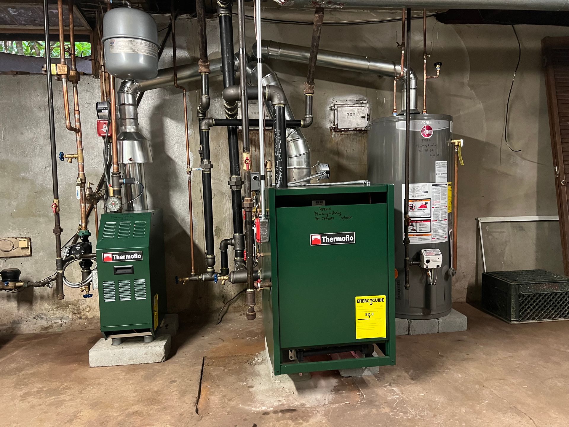 There are two boilers and a water heater in the basement.