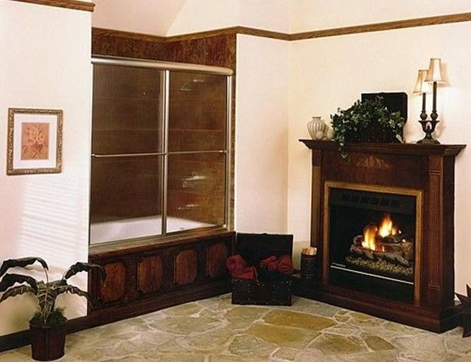 Bathroom with fireplace and shower behind a decorative wood panel.