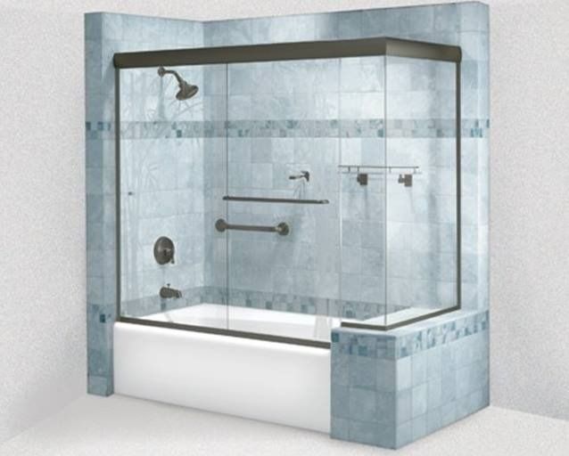 Corner bathtub with glass shower doors and grab bars. Blue tile, bronze fixtures.