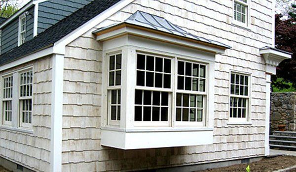 A house with a bay window on the side of it