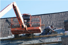 man fixing roof