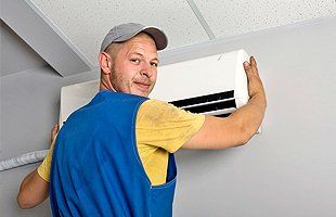 Man installing air conditioning