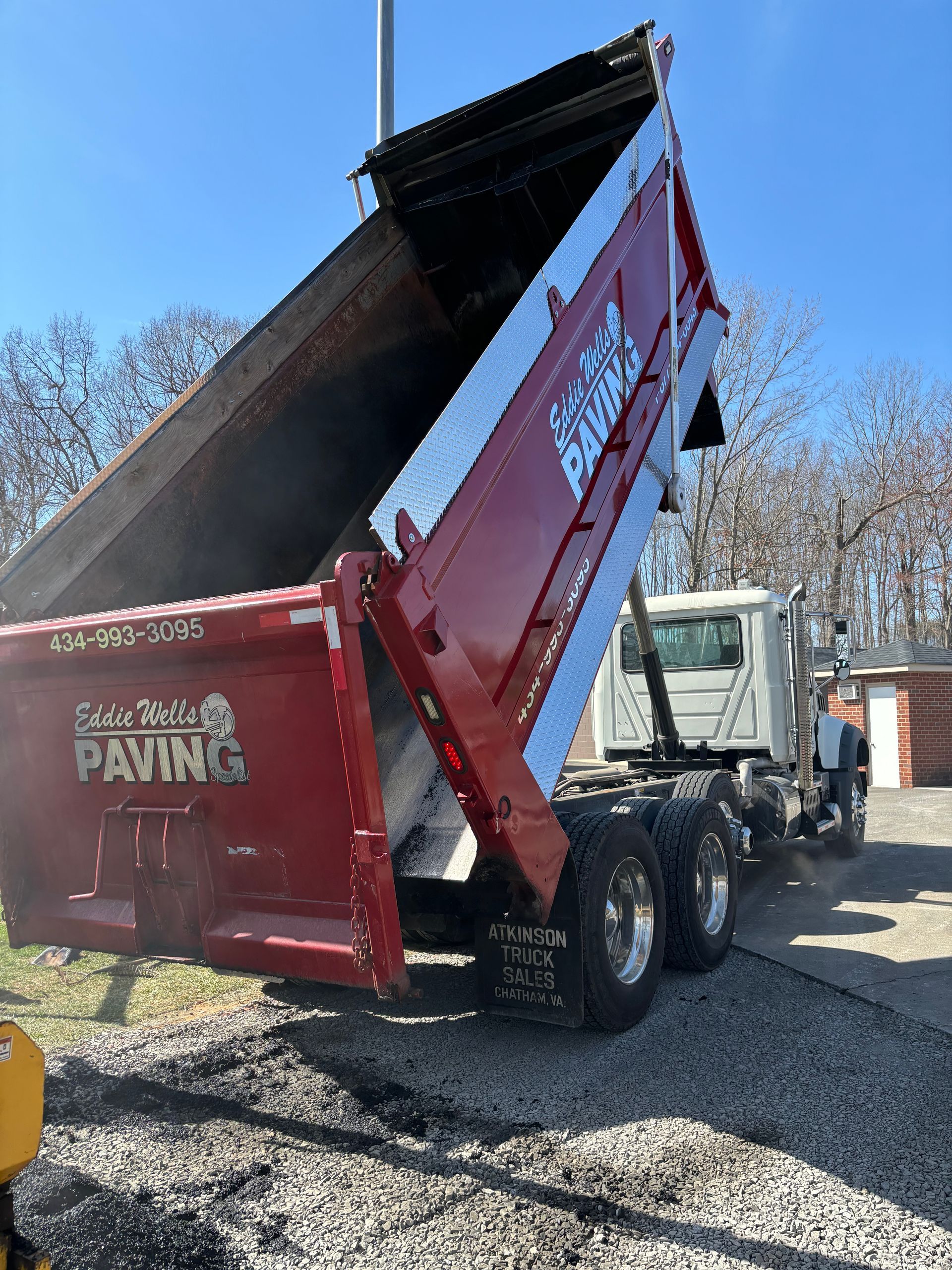 Eddie Wells Paving truck with the dump truck portion up