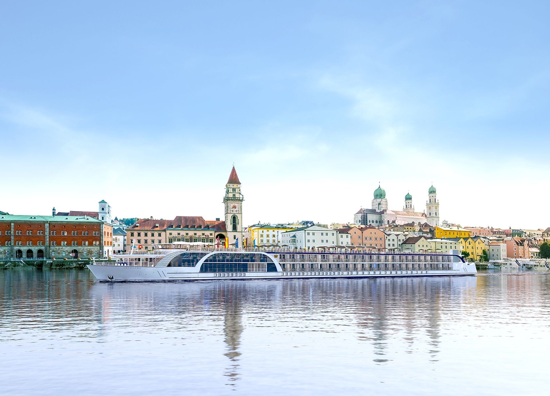 A boat is floating on top of a body of water in front of a city