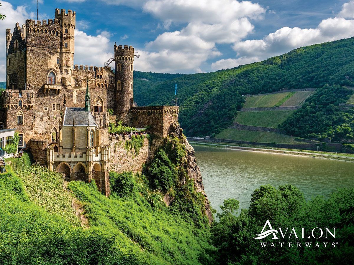 A castle is sitting on top of a hill 