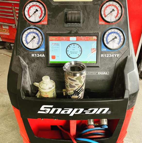A snap-on machine with a clock on it