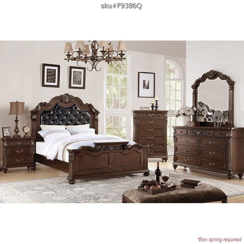 intricate wooden queen bed with cushioned headboard