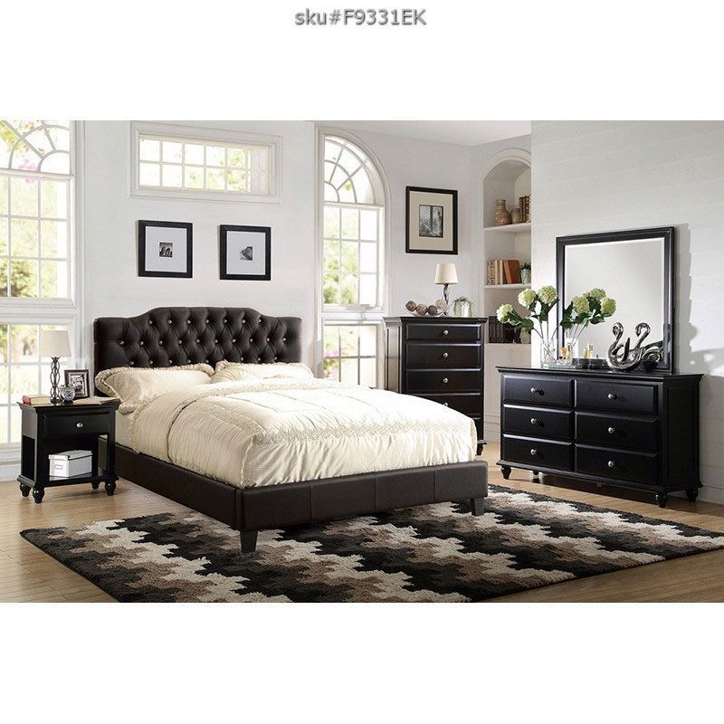 black king-size bed with cushioned headboard