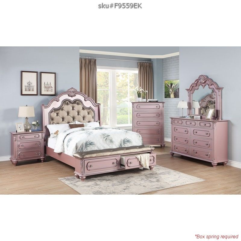 pink king-size bed with cushioned headboard and drawers