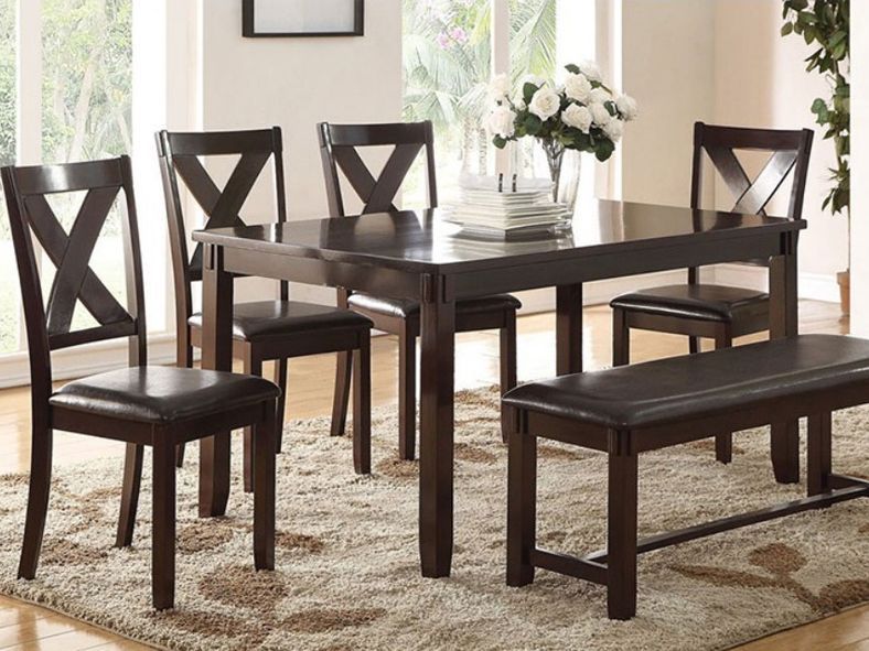 wooden dining table with 4 chairs and a bench