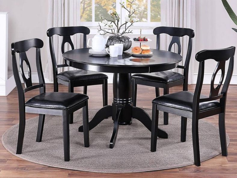dark brown round dining table and four chairs